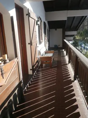 a balcony with stairs and a bench on it at I mughi - Cortina in Cortina dʼAmpezzo