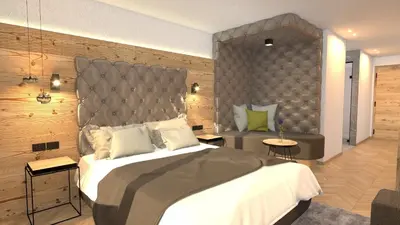 a bedroom with a large bed with a padded wall at Hotel Stoeres - Active wellbeing in San Cassiano