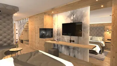 a bedroom with a bed and a tv on a wall at Hotel Stoeres - Active wellbeing in San Cassiano