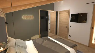 a bedroom with a bed with a glass wall at Hotel Stoeres - Active wellbeing in San Cassiano