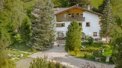 an aerial view of a house with trees at Villa Moroder in Ortisei