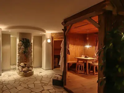 a room with a table and a dining room at Dolomites Apartments Ciasa Vally in San Cassiano