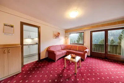 a living room with a couch and a table at Residence Ulrike in Nova Levante