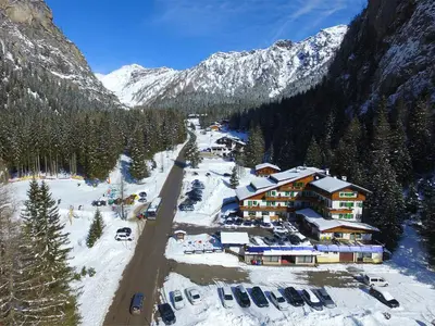 a ski lodge in the middle of a snowy mountain at Hotel Roy in Malga Ciapela