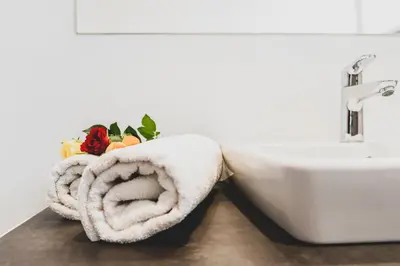 a towel sitting next to a sink in a bathroom at Falgerhof in Vollan