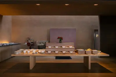 a table with a bunch of food on it at Vigilius Mountain Resort in Lana