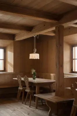 a dining room with a wooden table and chairs at Vigilius Mountain Resort in Lana