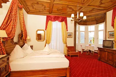 a bedroom with a large bed in a room at Villa Maria in Tirolo