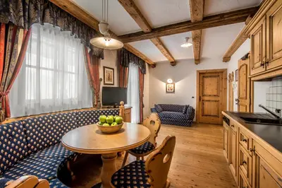 a kitchen with a table with a bowl of fruit on it at Residence Vila in Colfosco
