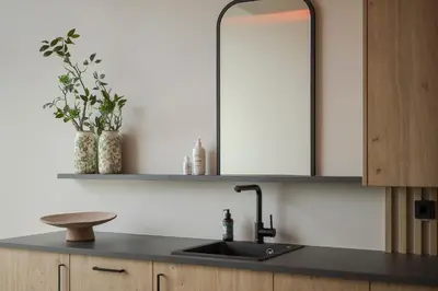 a bathroom with a sink and a mirror at La Maiena Meran Resort in Marlengo