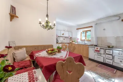 a kitchen with a table with a bowl of fruit on it at Gemangerhof in Bressanone