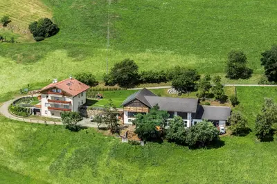 an aerial view of a house in a field at Finggeneislerhof in Villandro