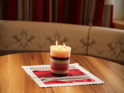 a candle sitting on top of a table at Christeinerhof in Santa Cristina in Val Gardena