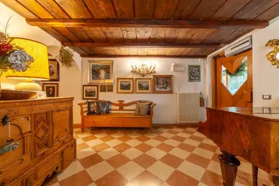 a living room with a couch and a table at Residenza Bagni & Miramonti in Cavalese