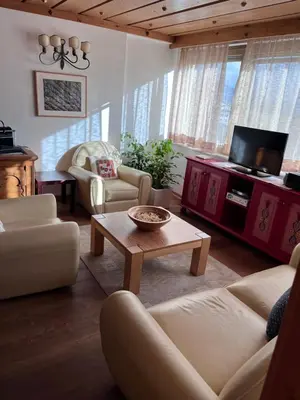 a living room with a couch and a coffee table at Residenza Bagni & Miramonti in Cavalese