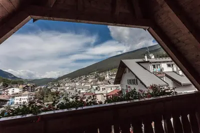 a view of a city from a window at Hotel Garni Villa Park in Ortisei