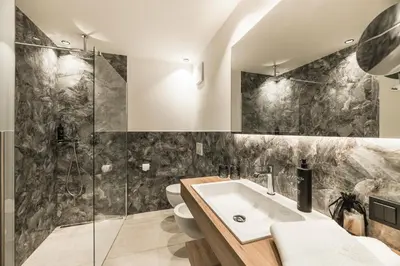 a bathroom with a sink and a shower at Boutique Hotel Planlim in Ortisei