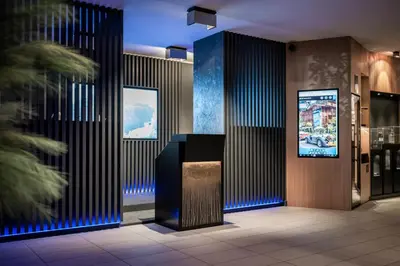 a hallway with a door to a room with skis at Alpstay - Smart Hotel Saslong in Santa Cristina in Val Gardena
