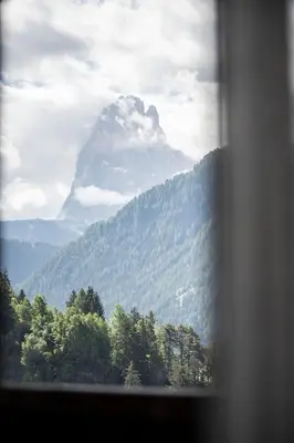 a view of a mountain from a window at Residence Cesa Sassela in Ortisei