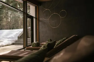 a living room with a couch and a window at Hotel Waldsee in Fiè