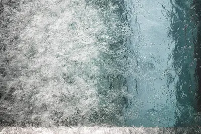 a close up of a wave in the water at Christophorus Mountain Residence in San Vigilio Di Marebbe
