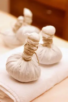 three garlic knots sitting on top of a towel at Christophorus Mountain Residence in San Vigilio Di Marebbe