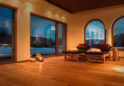 a room with two beds and large windows at Herol - my mountain retreat in Luson