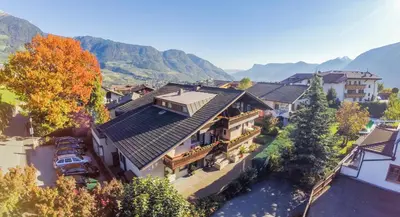 an aerial view of a house with a roof at Pension Lafod in Tirolo