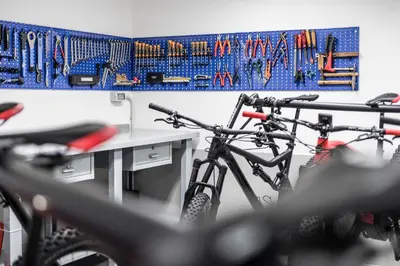 a group of bikes parked next to a desk at Sporthotel Exclusive in San Vigilio Di Marebbe
