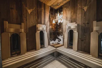 a room with wood paneling and a row of ventils at Hotel Chalet S - Dolomites Design - adults recommended in Selva di Val Gardena