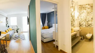 two views of a bedroom and a living room at Stay COOPER l MAVIK Loft & Apartment in Bolzano