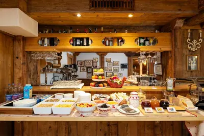 a kitchen with a counter with food on it at Chalet Barbara in Arabba