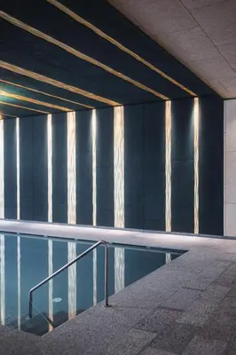 a pool of water in a building with a ceiling at Hotel Garni Andrianerhof in Andrian