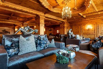 a living room with a couch and a table at Sporthotel Arabba in Arabba