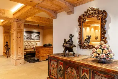 a mirror on top of a wooden table in a room at Sporthotel Arabba in Arabba