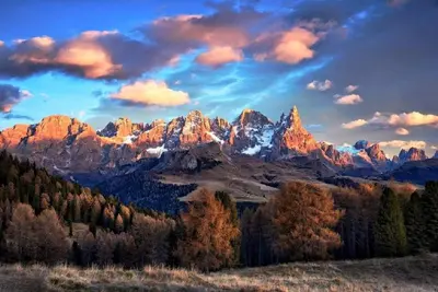 a view of a mountain range with trees in the foreground at La Piccola Casa Verde in Canale San Bovo