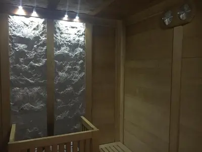 a room with a window with a view of a mountain at Garni Enrosadira in Vigo di Fassa