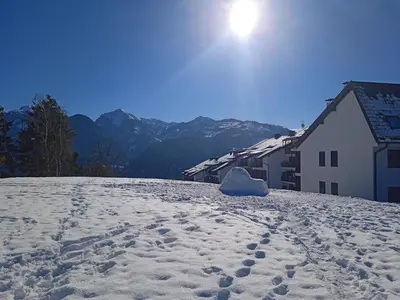 a block of snow sitting on top of a snow covered hill at Casa Tiziana By Go New Location in Carano
