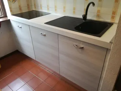 a kitchen with a sink and a counter at Casa Tiziana By Go New Location in Carano
