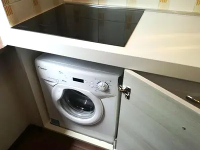 a washer and dryer in a small room at Casa Tiziana By Go New Location in Carano