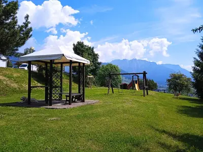 a park with a swing set and a playground at Casa Tiziana By Go New Location in Carano