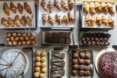 a display of different types of pastries and desserts at Best Western Hotel Nevada in San Vito di Cadore