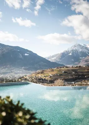 a view of a lake with mountains in the background at Hotel Rosengarten (Schenna Resort) in Schenna