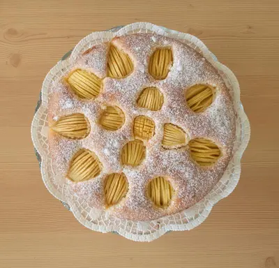 a pie sitting on top of a wooden table at Garni Sunela B&B in Selva di Val Gardena