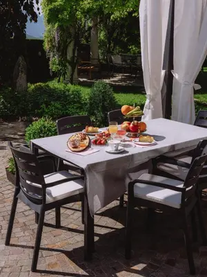 a table with plates of food on it at Relais Villa Quercia in Tassullo