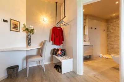 a room with a desk and a chair in a bathroom at Relais Villa Quercia in Tassullo