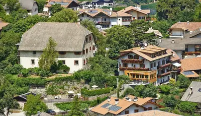 an aerial view of a village with houses at Garni Pramstrahler in Chiusa