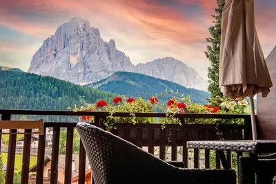 a balcony with a view of a mountain at Appartamenti Insam in Santa Cristina in Val Gardena