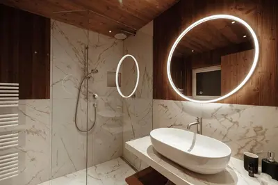a bathroom with a sink and a mirror at Appartamenti Insam in Santa Cristina in Val Gardena
