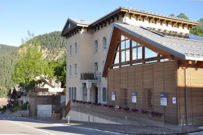 a large building on the side of a street at Appartamento San Marco in Caprile